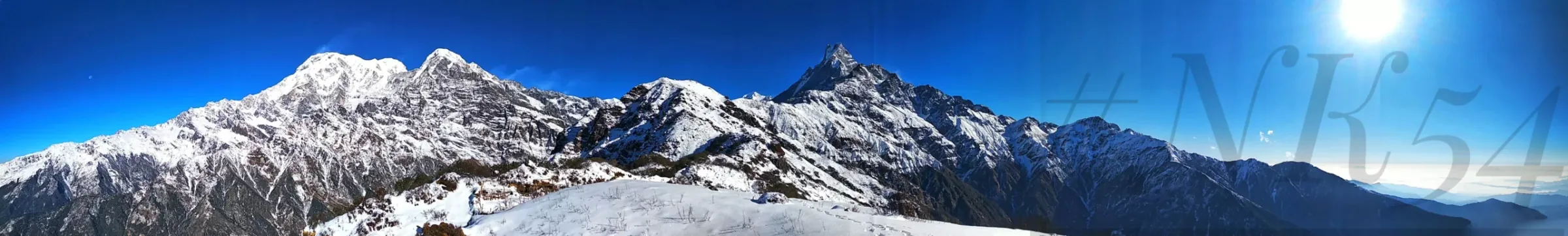 Panorama of snow-covered Himalayan peaks on the Mardi Himal trek in Nepal